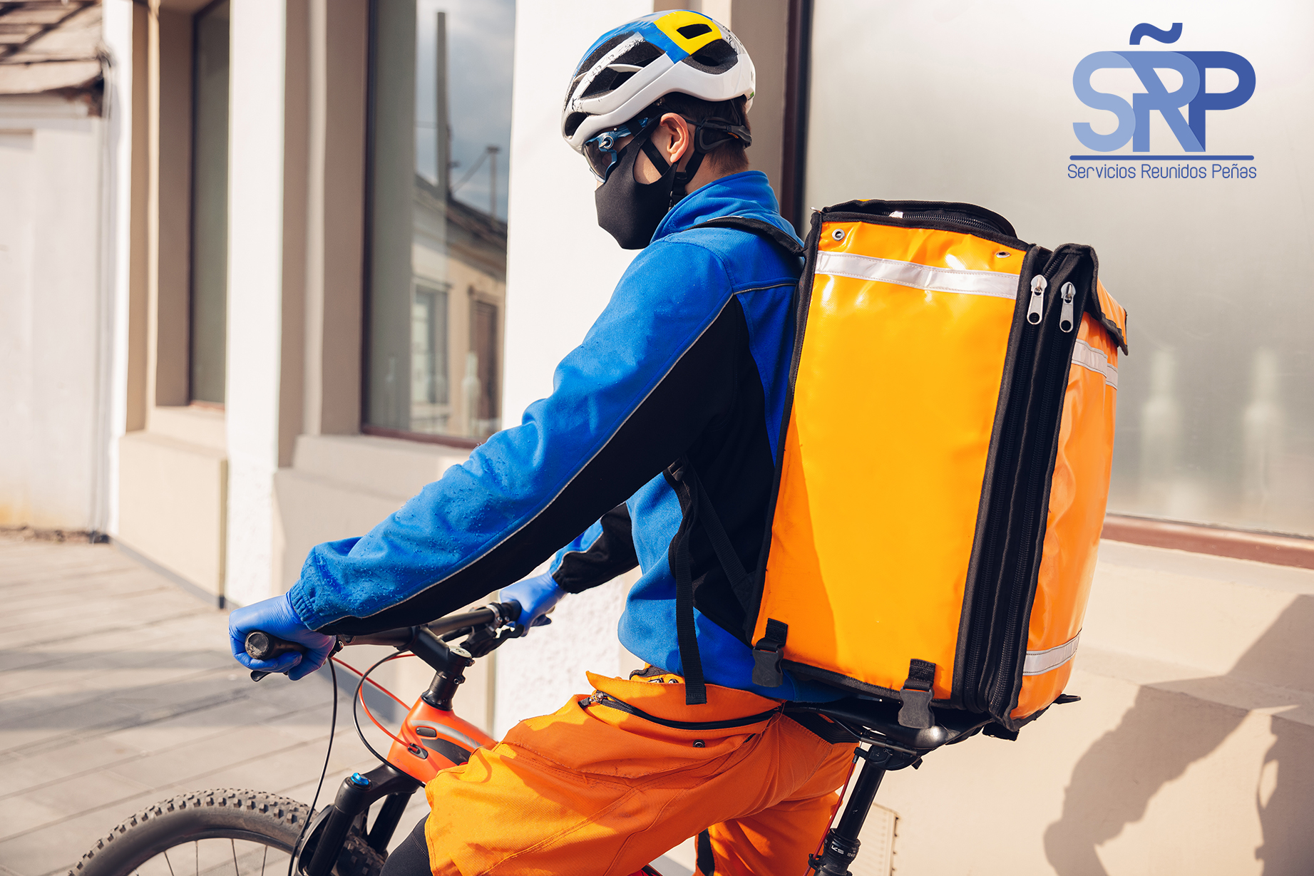 Contacless delivery service during quarantine. Man delivers food and shopping bags during isolation