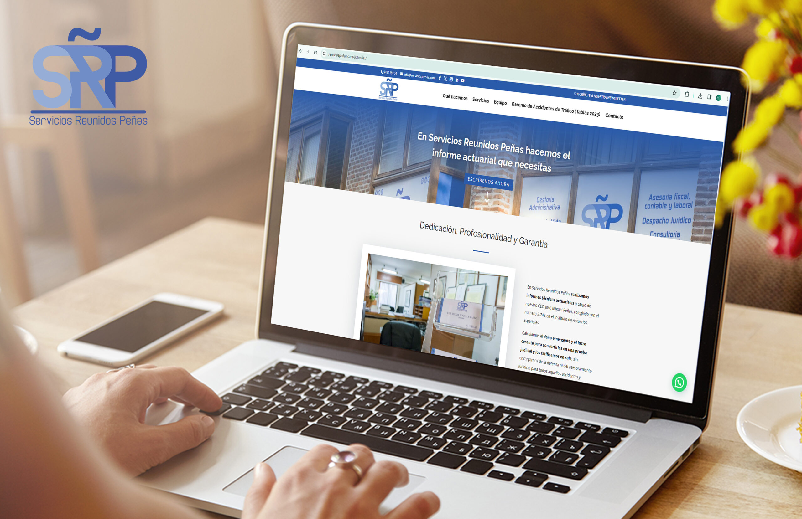 Rear view of high school girl using laptop for doing homework, browsing Internet, searching for required information, sitting at desk with mobile phone with copy space screen lying next to her