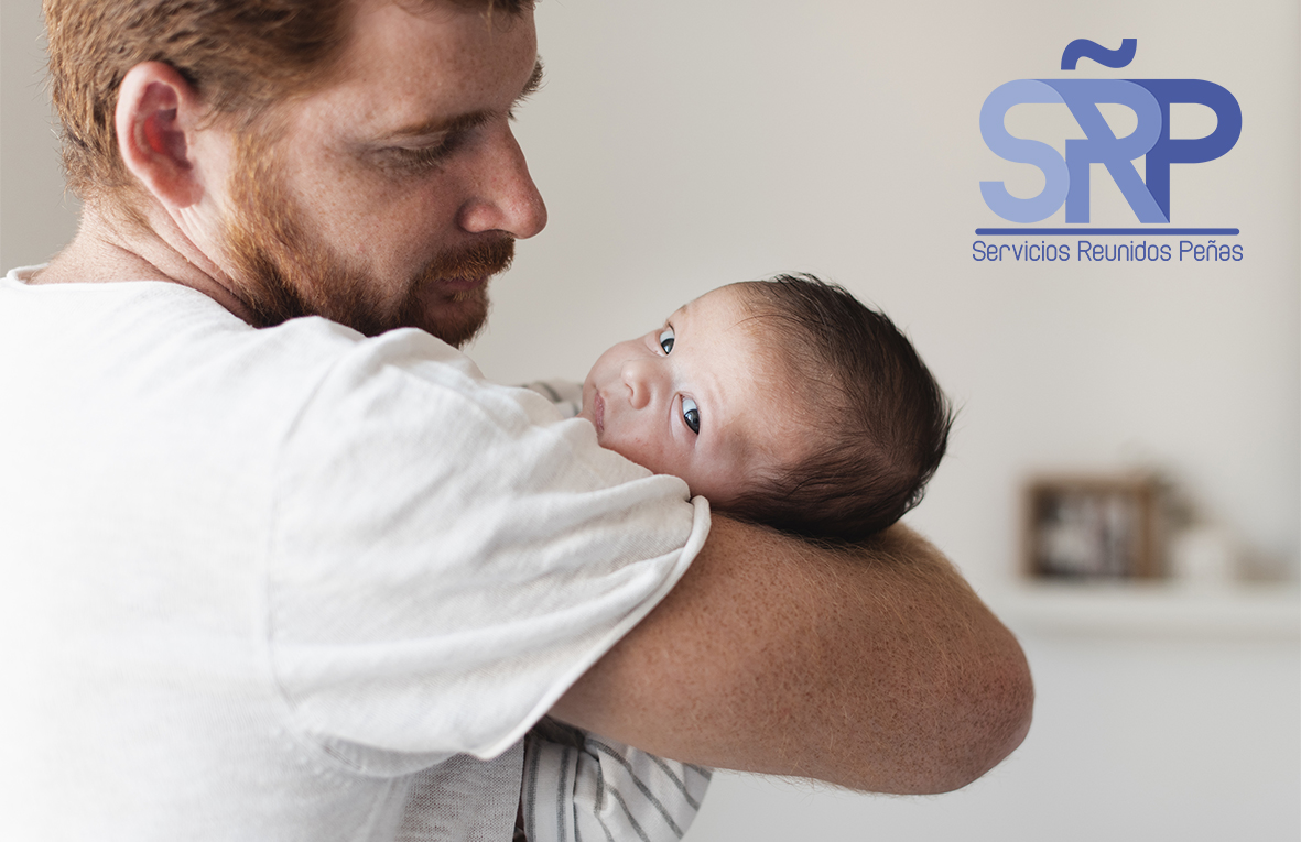 close-up-father-holding-baby-with-blue-eyes